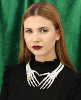 Skeleton hands necklace