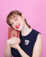 Cat sleeping on books Essentials brooch