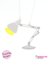Changing-desk-lamp-essentials-necklace--interactive---essentials-la-vidriola-detail-change