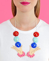 Juggling-hands-necklace-la-vidriola-plastic-jewellery-circus-where-the-magic-happens-product